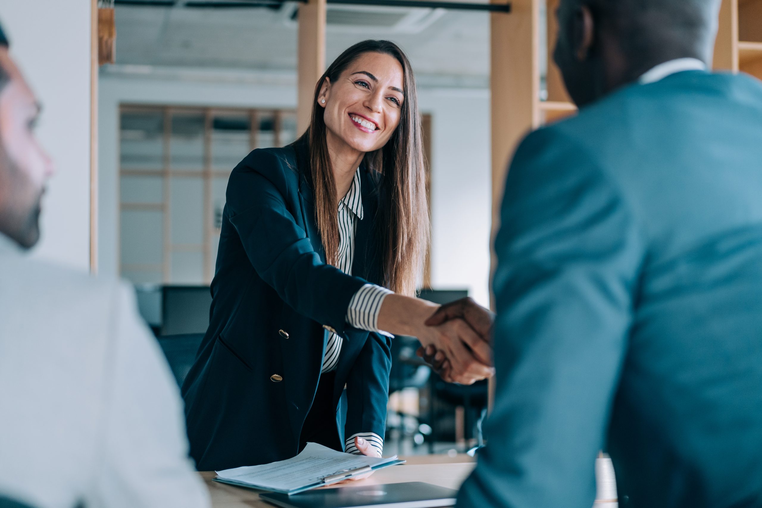 Businesswoman shaking hands with a client