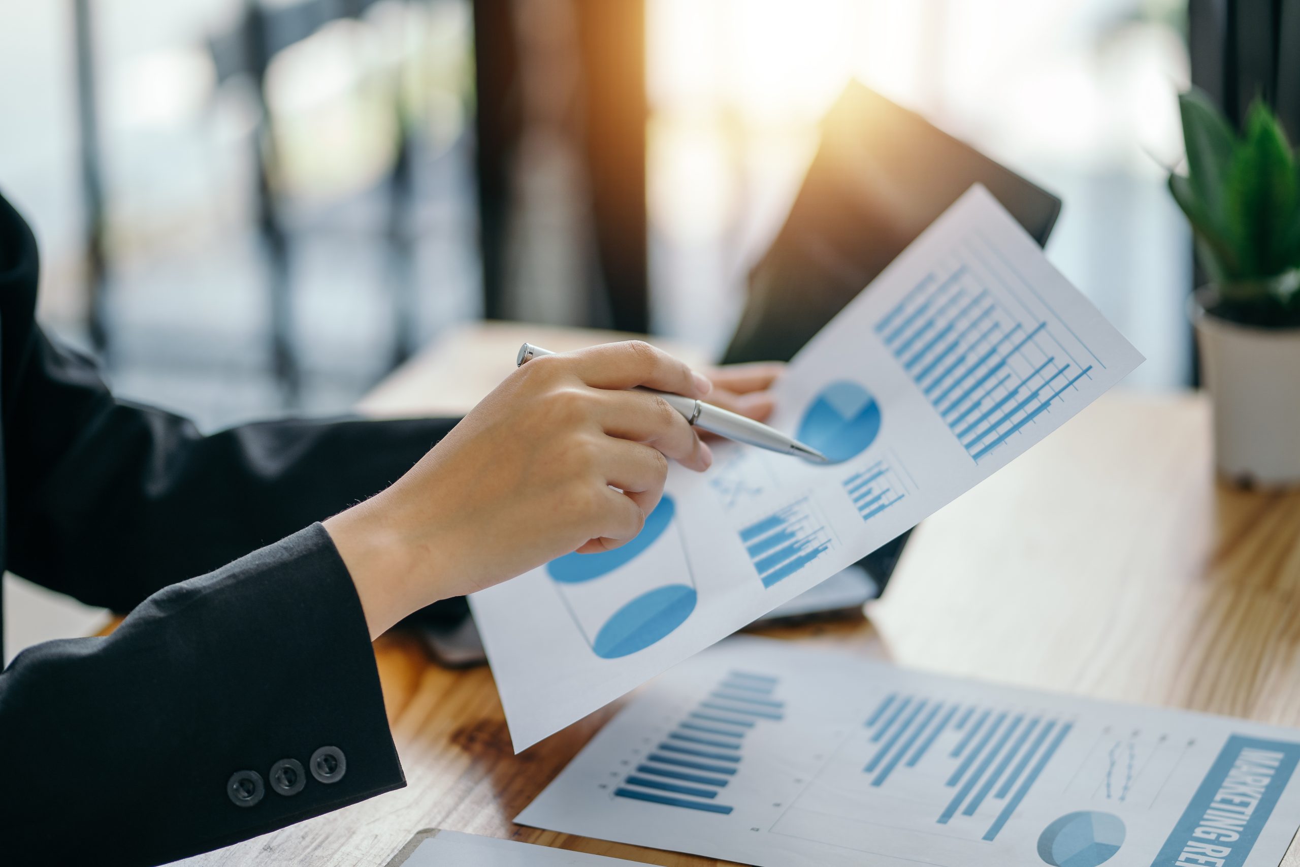 Businesswoman pointing to a graph on a report